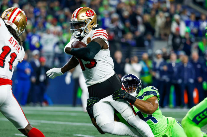 San Francisco 49ers wide receiver Deebo Samuel (19) rushes against Seattle Seahawks linebacker Bobby Wagner (54) during the first quarter at Lumen Field.